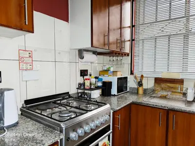 a kitchen with a stove top oven in a kitchen at Twiga Luxe in Arusha