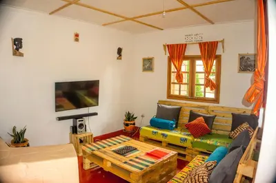 a living room with a couch and a table at Moshi hostel lodge in Msaranga