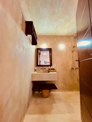 a bathroom with a sink and a mirror at Sereno Cabana in Arusha