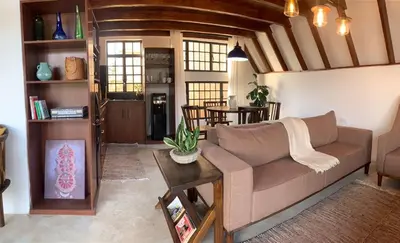 a living room with a couch and a table at Sereno Cabana in Arusha