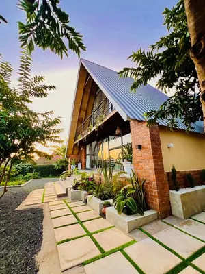 a brick building with a pathway in front of it at Sereno Cabana in Arusha
