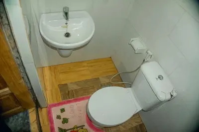 a bathroom with a toilet and a sink at Moshi hostel lodge TANZANIA in Moshi