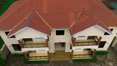 a model of a house with a red roof at Silent Inn Apartments in Arusha