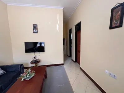 a living room with a couch and a table at Beego Apartments in Arusha