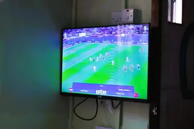 a flat screen tv hanging on a wall at Bamboo Savannah in Arusha