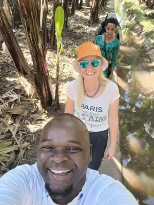 a man and a girl standing in the water at Jangwani River View Suits in Mto wa Mbu