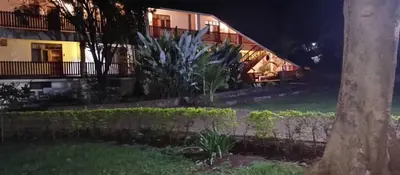 a view of a building at night at Kilimanjaro Lodge - MCF in Moshi