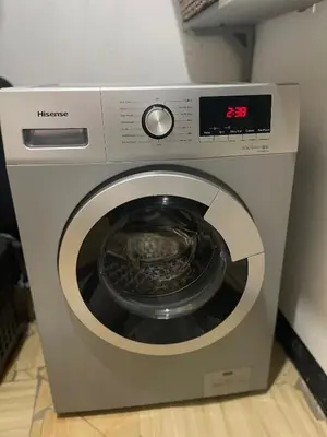 a washing machine with a digital clock on it at Casa Mianzini in Arusha