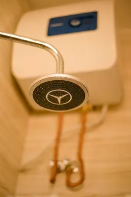 a close up of a toilet with a holder at Hecasa Apartments in Arusha