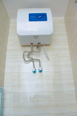 a washing machine sitting on top of a wooden floor at Hecasa Apartments in Arusha