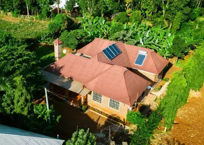 an aerial view of a house with a roof at Rau River House - Moshi in Msaranga