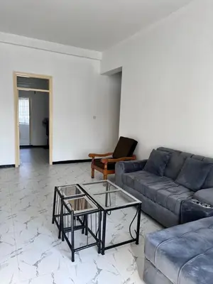 a living room with a couch and a coffee table at Maya in Arusha