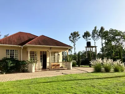 a house with a red roof at Allamanda House Meru in Arusha