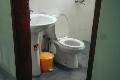 a bathroom with a toilet and a sink at Mesa, Mama Ket Homes Arusha in Arusha