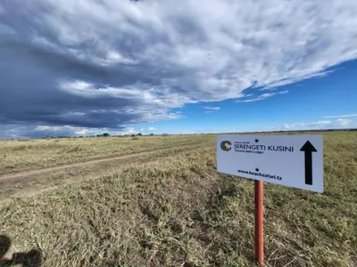 a sign in the middle of a field at Africa Safari Serengeti Kusini in Serengeti National Park