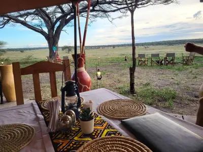 a table with a view of a field at Africa Safari Serengeti Kusini in Serengeti National Park