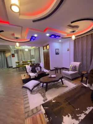 a living room with couches and a table at SandS Escape in Arusha