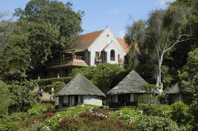 a house on top of a hill with a garden at Arusha Serena Hotel in Nkoanrua