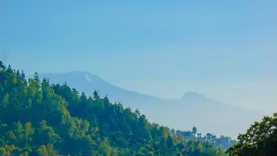 a view of a hill with a mountain in the background at Makini Swing Adventure in Arusha