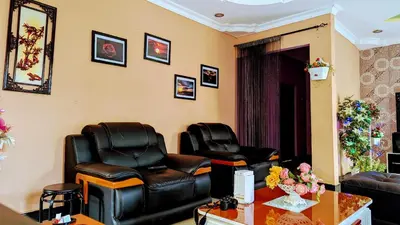 a waiting room with two leather chairs and a table at 3 Bedroom Appartment with Beautiful view of Kilimanjaro Mountain in Moshi