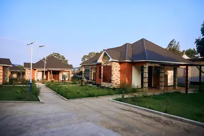 a row of houses with a driveway at Orlando Cottages in Arusha