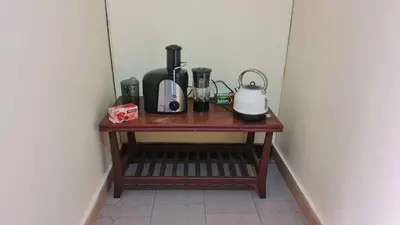 a table with appliances on it in a room at Space haven 02 in Arusha