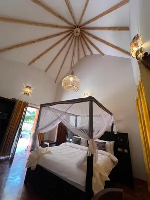 a bedroom with a bed with a canopy at Kili Touch Apts in Arusha