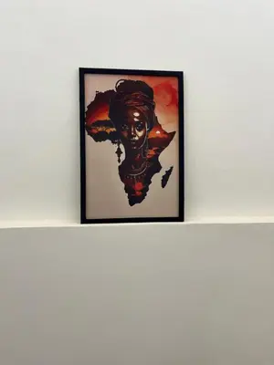 a framed painting of a woman on a shelf at Urban Nest in Arusha