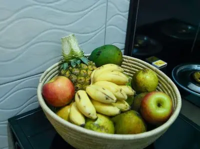 a basket of fruit sitting on a table at ILBORU HAVEN HOMEs in Arusha