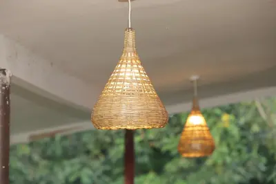 two lights are hanging from a ceiling at Diamond Delight Boutique Hotels in Moshi