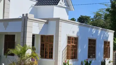 a white house with a lot of windows at SEBA & Cherise in Usa
