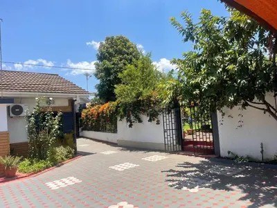 a house with a gate and a brick driveway at JDs Home in Arusha
