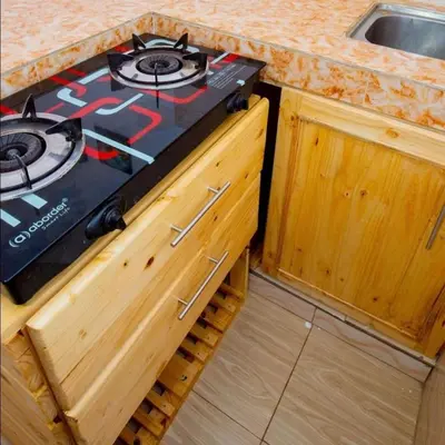 a stove in a kitchen with a counter top at Bethlehem home in Arusha