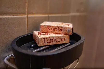 three wooden boxes sitting on top of a stove at Divine Royal Residences in Arusha