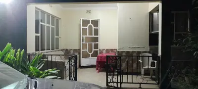 a view of a room with a door and a table at December apartment in Sokon