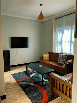 a living room with a couch and a coffee table at Kanyigo homes in Arusha