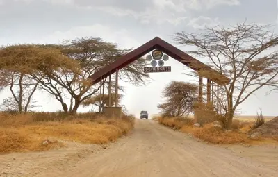 a sign on the side of a dirt road at Africa Safari South Serengeti Ndutu Camping in Sinoni