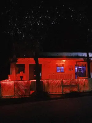 a red building with lights on it at night at Last fantasy ndoto ya mwisho in Arusha