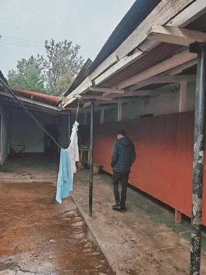 a man is standing outside of a building at Last fantasy ndoto ya mwisho in Arusha