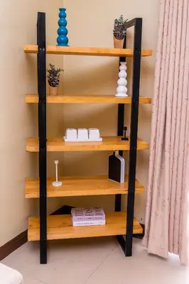 a shelf in a room with wooden shelves at Timeless Escape in Arusha