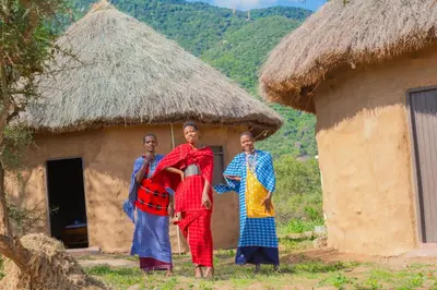 three men standing in front of a hut at Kili View Maasai Lodge in Longido
