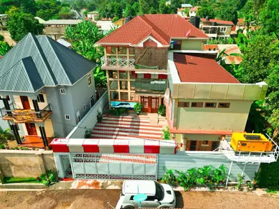 an overhead view of a house with a car parked in front at River House Lodge International in Arusha