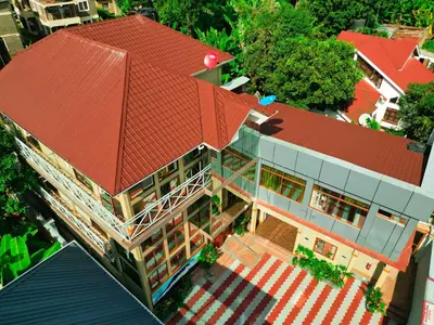 an overhead view of a house with a red roof at River House Lodge in Arusha
