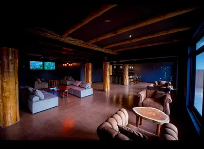 a large living room with couches and a table at Ritzy Arcadia Cottages in Arusha