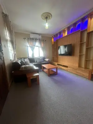 a living room with a couch and a table at Modern Standalone house in Themi