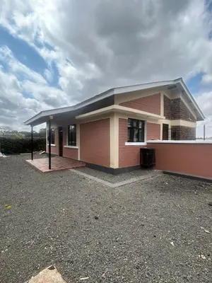 a large house with a driveway in front of it at Modern Standalone house in Themi