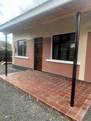 a brick walkway outside of a house at Modern Standalone house in Themi