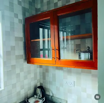 a kitchen cabinet with a pot inside of it at Kanyigo homes Apartments in Arusha