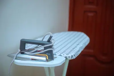 a purse sitting on a table with a chain at Ngorongoro Gateway Homestay in Karatu