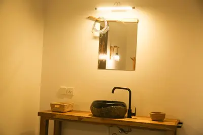 a bathroom with a sink and a mirror at Hakuna in Arusha